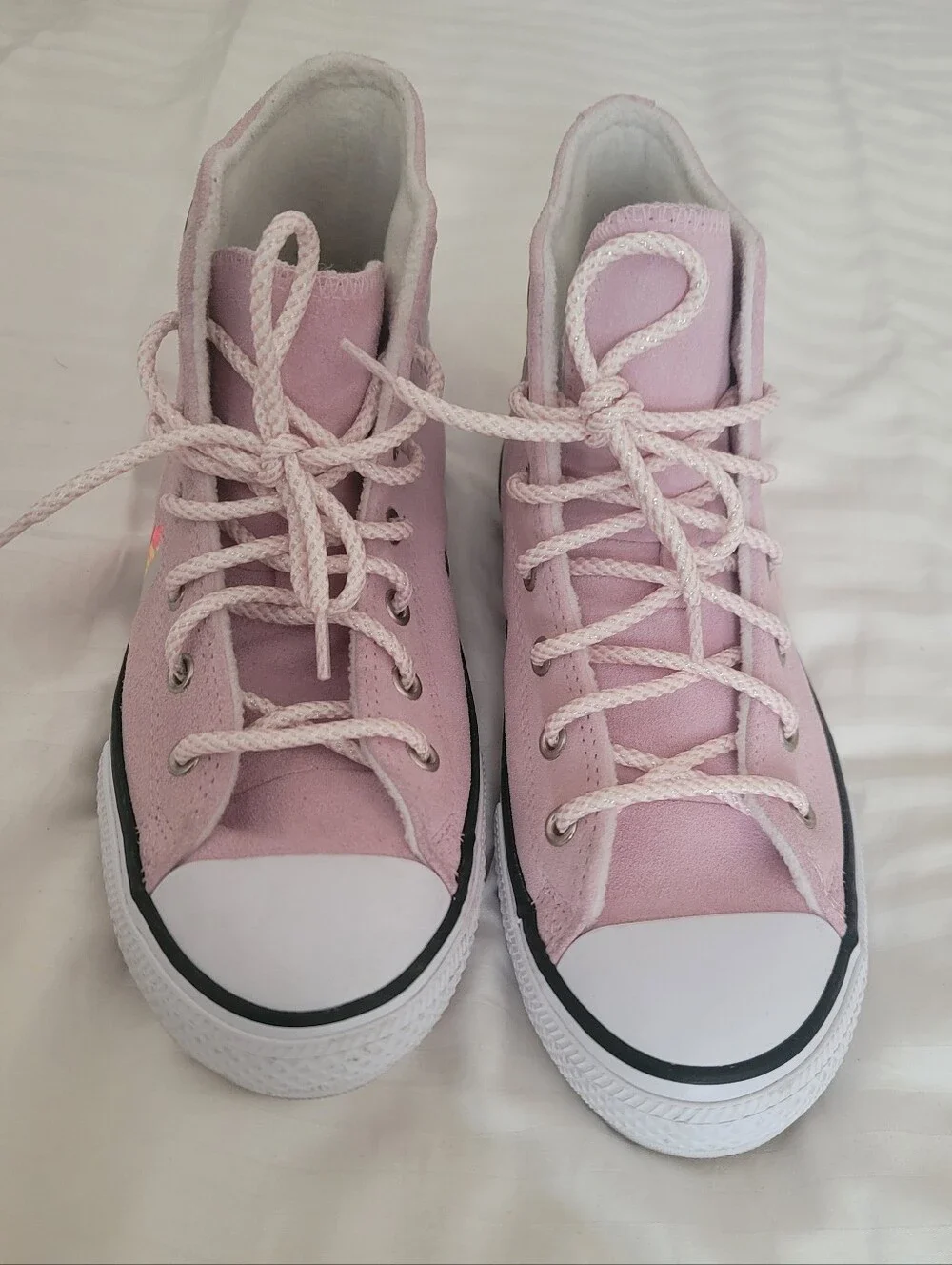 Pink Converse Chuck Taylor All Star High sneakers feature a playful llama